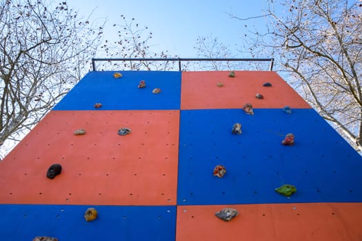 A wall to train climbers. Artificial stones are ledges on the wall.