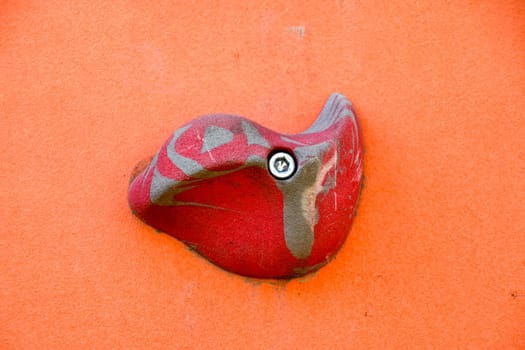A wall to train climbers. Artificial stones are ledges on the wall.