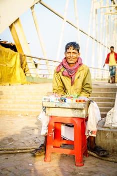 Chittagong, Bangladesh, December 22, 2017: Portrait of a street vendor selling traditional snacks near Chittagong port.