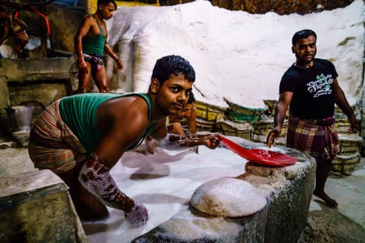 Chittagong, Bangladesh, December 22, 2017: Hard labor in a salt factory in Chittagong, Bangladesh