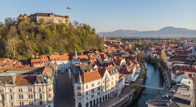Aerial drone panoramic view of Ljubljana, capital of Slovenia in warm afternoon sun.