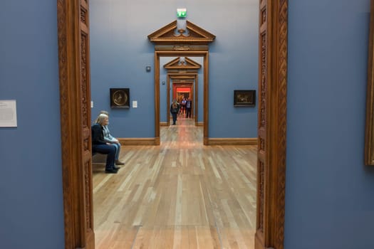 Dublin, Ireland - Feb 20th, 2020: National Gallery of Ireland Building Indoors. People visiting historic wings