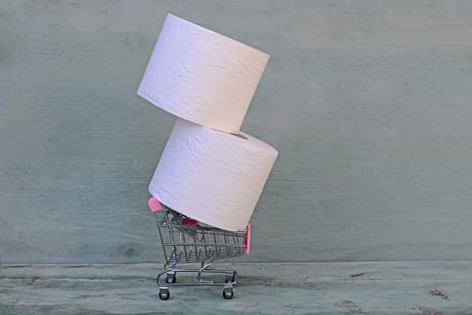 Bulk purchase of toilet paper. Toilet paper in shopping cart