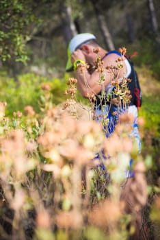 Photography session of trail runner runnig in the middle of nature and in the mountains. Preparing and interviewing