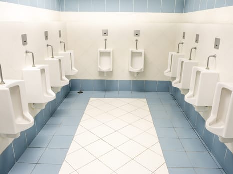 a clean new public modern toilet room empty