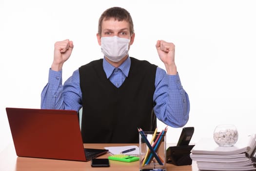 Office specialist in medical mask joyfully celebrates success
