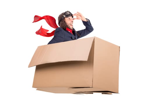 Businessman flying a carboard box over the imaginary skies