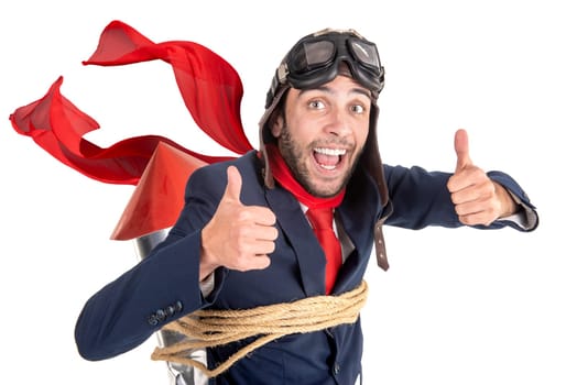 Businessman with home made rocket and googles ready for a challenge