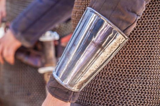 Reconquest warrior covered with arm bracer or vambrace. Medieval warrior equipment