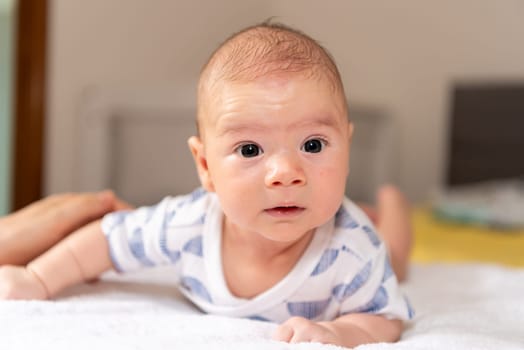 Adorable little baby boy during tummy time