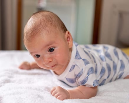 Adorable little baby boy during tummy time