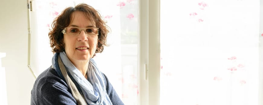 portrait of a middle-aged woman in her house