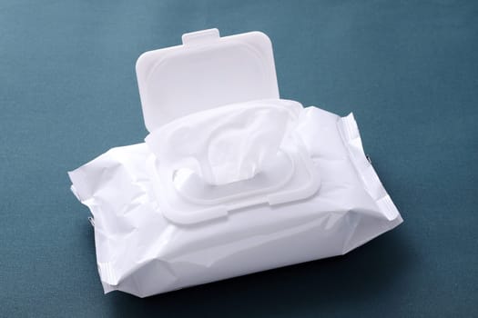 wet tissue paper package on wooden table
