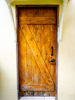 New brown modern wooden door lock in house interior