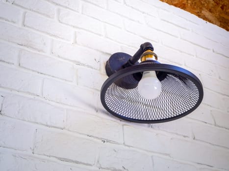 vintage style hanged ceiling lamp warm orange tone light color concrete background wall