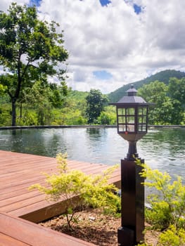Outdoor luxury swimming pool at the holiday, background is beautiful mountain