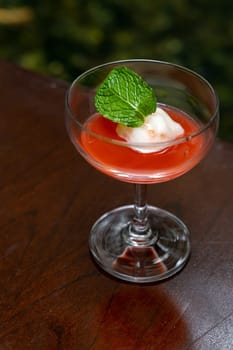 Welcome drink red mocktail on wooden table