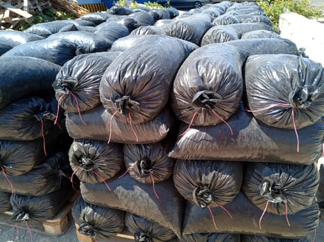 Packages with rubble and sand on the construction site. Building materials base.