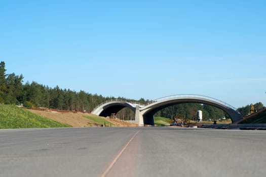 Construction of the A14 motorway with a green bridge for animals north of the village of Dolle in Germany