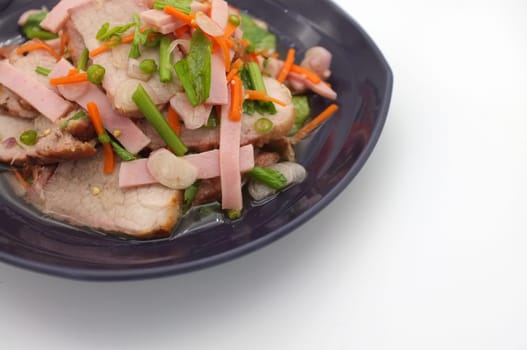 Spicy salad of roasted pork on white background , Thai style food