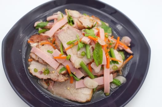 Spicy salad of roasted pork on white background , Thai style food