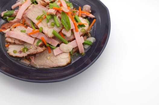 Spicy salad of roasted pork on white background , Thai style food