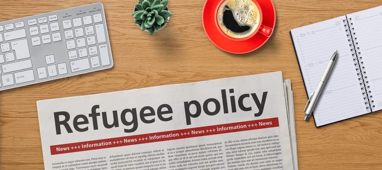 Newspaper on a desk - Refugee policy