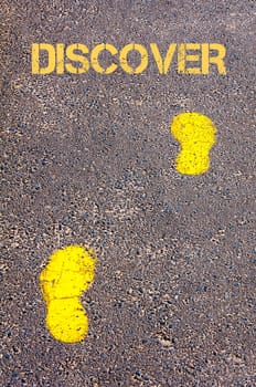 Yellow footsteps on sidewalk towards Discover message, Exploration conceptual image