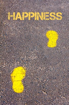 Yellow footsteps on sidewalk towards Happiness message, Serenity conceptual image
