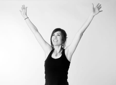 A monochrome representation of woman reaching up excited and happy