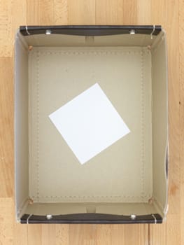 Storage boxes isolated on a wooden shelf
