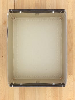 Storage boxes isolated on a wooden shelf