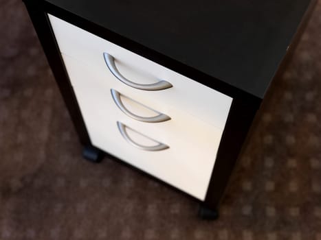 A close up shot of a set of office drawers