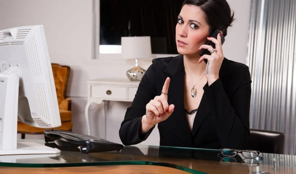 Woman at computer desks looks frustrated