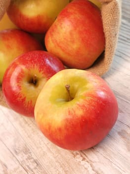 Fresh red apples in a canvas bag