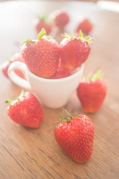 Fresh ripe strawberries on wooden background, stock photo