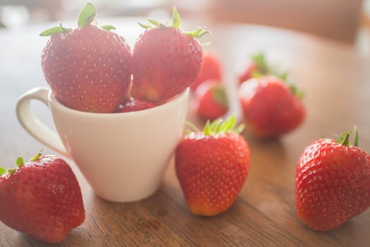 Fresh ripe strawberries on wooden background, stock photo