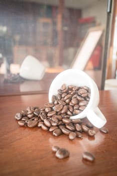Roast coffee bean in white mug, stock photo