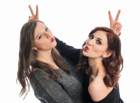 Two girlfriends silly around and show Victory