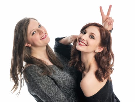 Two girlfriends silly around and show Victory
