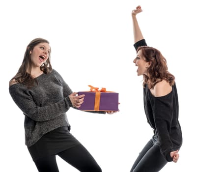 Two girls rejoice in a gift and cheer