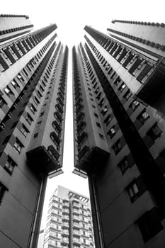 A black and white picture of two high rise buildings