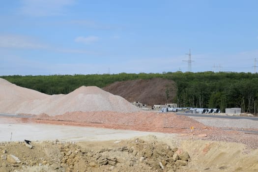 Construction of a new road and transport interchange. Work on reinforced concrete structures and road surface.