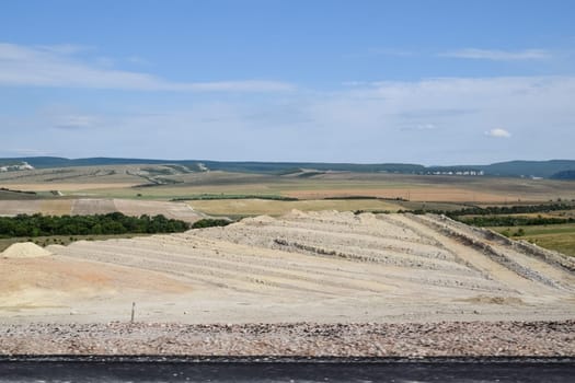 Construction of a new road and transport interchange. Work on reinforced concrete structures and road surface.
