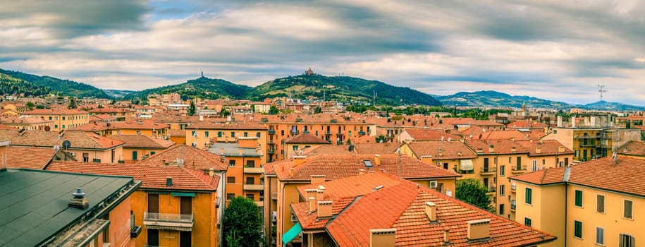 Panoramic view of rooftops and suburban hills in Bologna, Italy