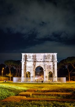 Nighttime view of the Arch of Constantine in Rome, Italy