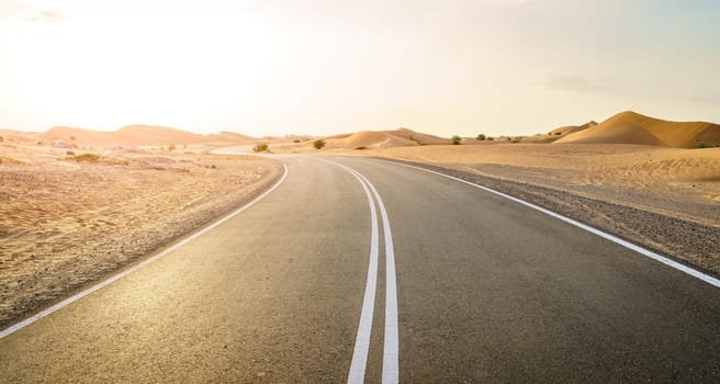 Empty highway through desert near Al Ain in UAE.