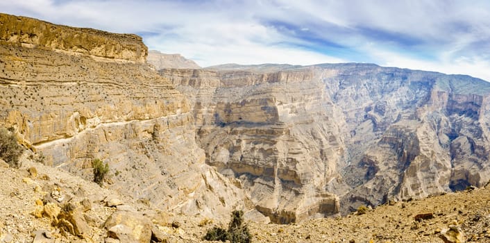 Panoramic view of Wadi Ghul aka Grand Canyon of Arabia in Jebel Shams, Oman