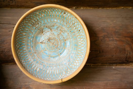 Typical ethnic porcelain bowl with floral and ornamentic pattern. Traditional souvenir from Belarus.