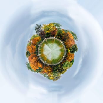 360 degree sphere of beautiful large lake and colorful autumn trees in the Buen Retiro Park near the Monument to Alfonso XII. Madrid, Spain